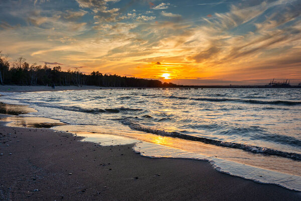 Sunset on the beach of the Baltic Sea in Gdansk, Poland