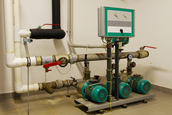 Water pipes in the boiler room and electric motors