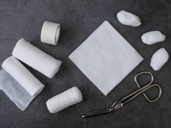 Medical bandages with scissors and sticking plaster. Medical equipment.