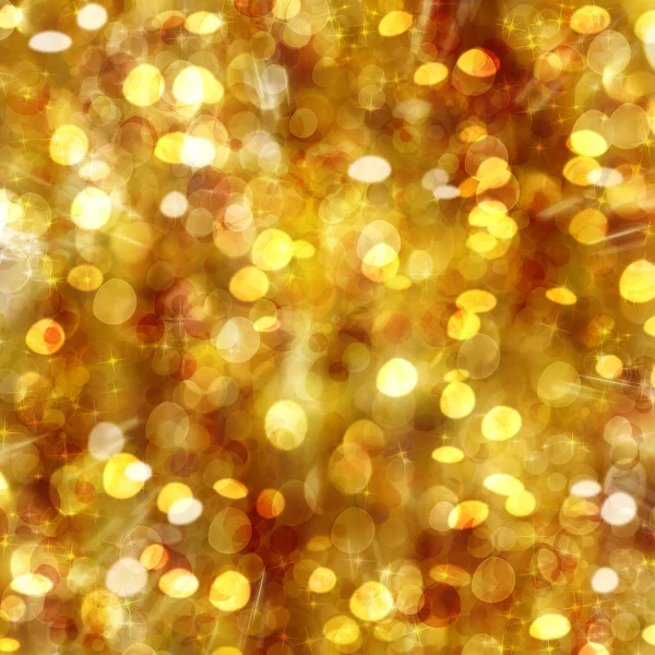 Fondo dorado con estrellas y bokeh — Foto de Stock