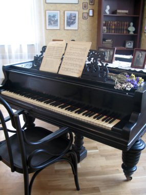 Black piano in room clipart