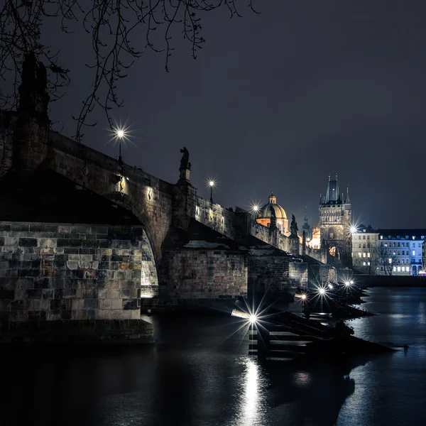 Charles bridge in Prague with lanterns — Stock Photo, Image