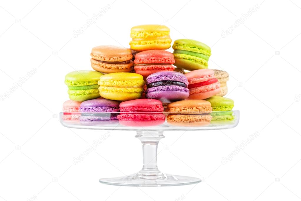 French colorful macarons in a glass cake stand