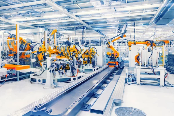自動車工場のロボットアームは ロイヤリティフリーのストック画像