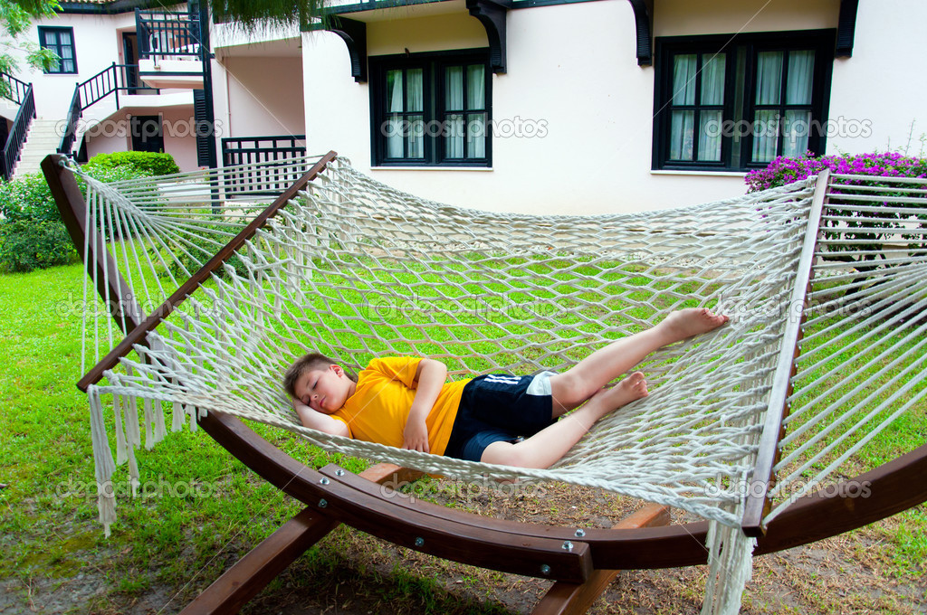 Boy resting in a hammock