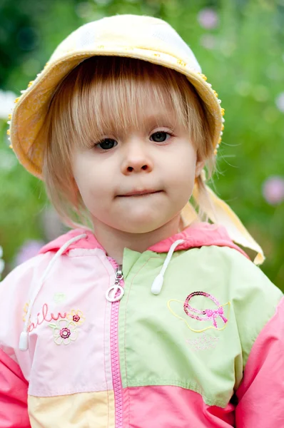 Little girl with flowers 2.5 years — Stock Photo, Image