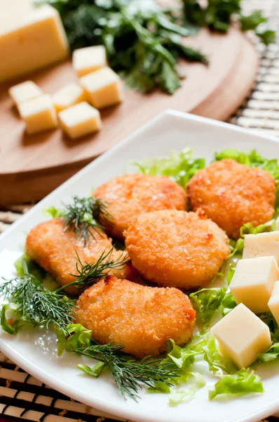 Chicken nuggets with cheese — Stock Photo, Image