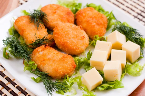 Chicken nuggets with cheese — Stock Photo, Image