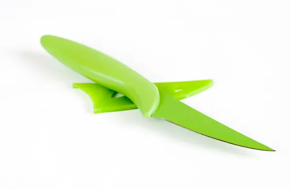 Зелений кухонний ніж на світлому фоні — стокове фото