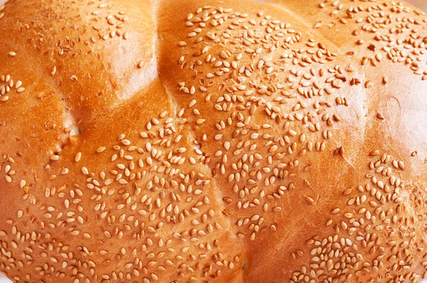 En läcker bröd med sesamfrön. bakgrund — Stockfoto