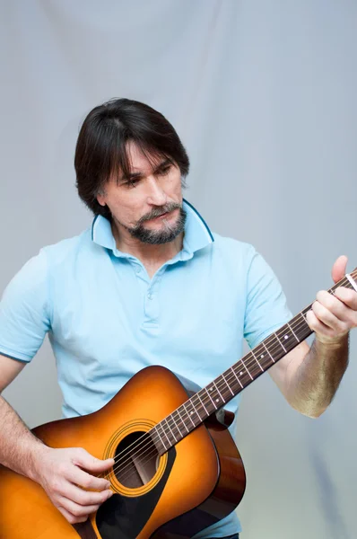 Man plays the guitar Stock Picture