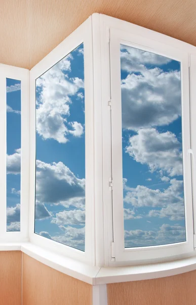 Plastic window with a beautiful sky — Stock Photo, Image