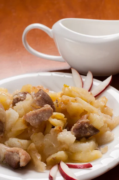 Fried potatoes with meat — Stock Photo, Image