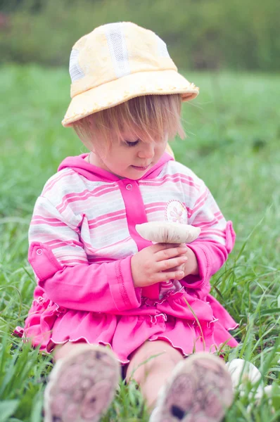 Little girl with white mushrooms — Stock Photo, Image