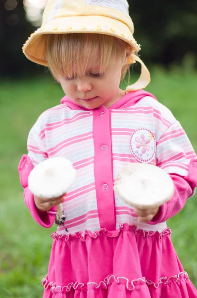 Little girl with white mushrooms — Stock Photo, Image