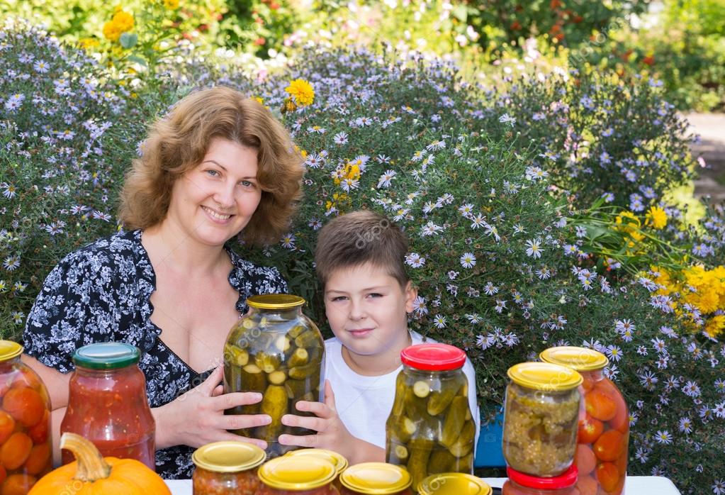 http://st.depositphotos.com/1007422/3264/i/950/depositphotos_32641659-Mom-with-her-son-and-home-canned-vegetables.jpg