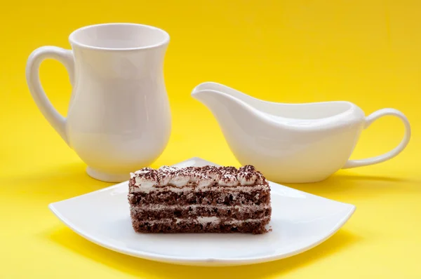 Chocolate cake on a yellow background — Stock Photo, Image