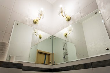 Detail of bathroom with mirrors clipart