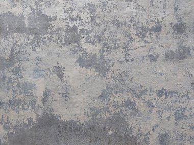 Eski alçılı duvar, çimentoda hafif boya, gri ton arka plan.