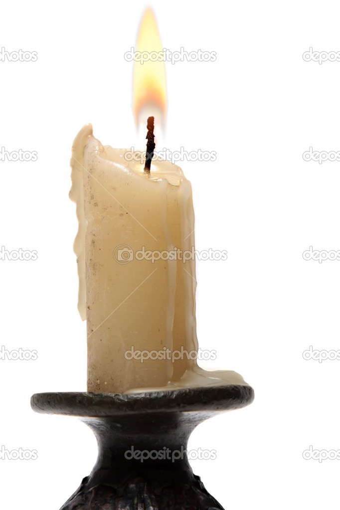 Old candle isolated on white background