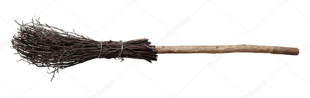 Old wicked broom isolated on white.