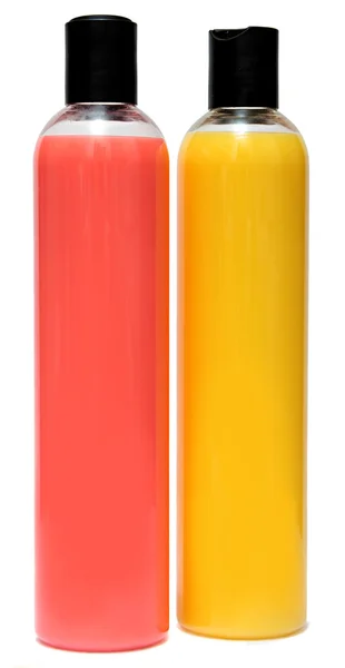 Dois frascos de plástico de shampoo ou gel de banho — Fotografia de Stock