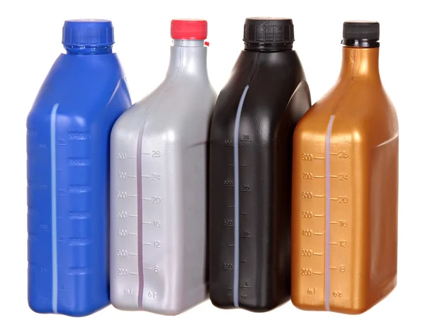 Plastic flessen uit auto-oliën geïsoleerd op een witte achtergrond — Stockfoto