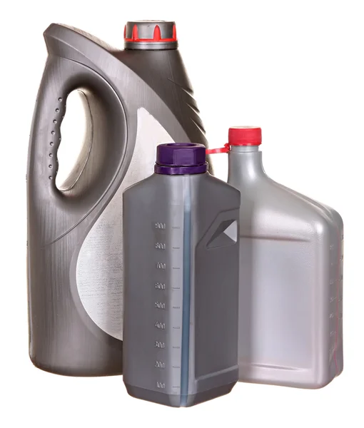 Plastikflaschen aus Autoölen isoliert auf weißem Hintergrund — Stockfoto