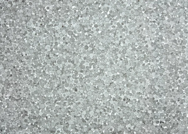 Grey foam plastic closeup. Polystyrene foam texture