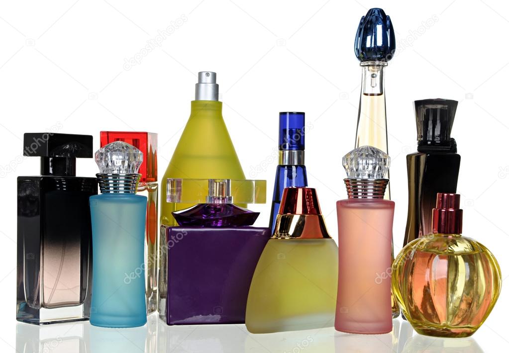 Set of different glass bottles of perfume isolated on a white