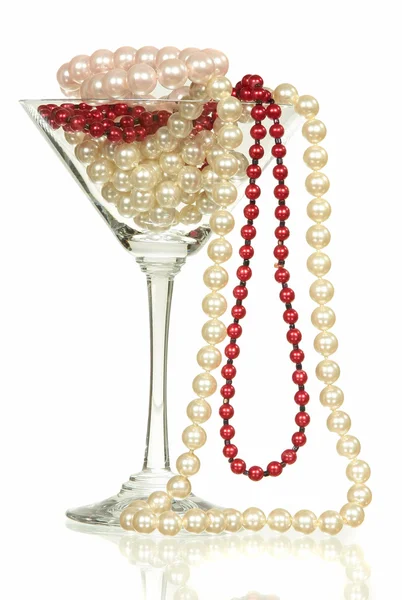 Beads from pearls in wine glass for martini isolated on white background — Stock Photo, Image