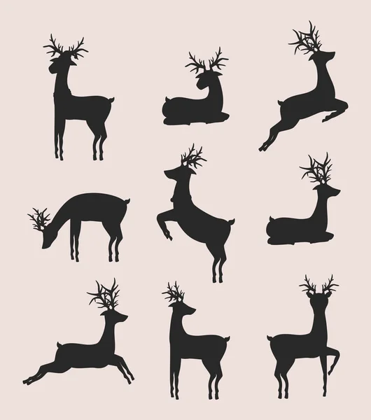 Nine reindeer animals silhouettes — Stock Vector