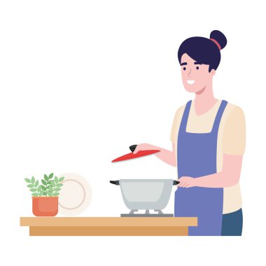 Ot ile yemek pişiren kadın