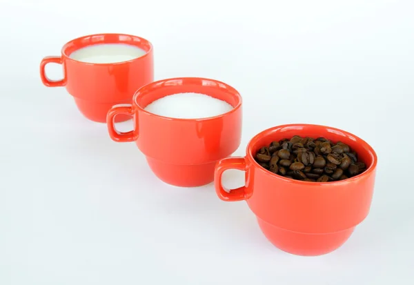 Three cups with coffee sugar and milk — Stock Photo, Image