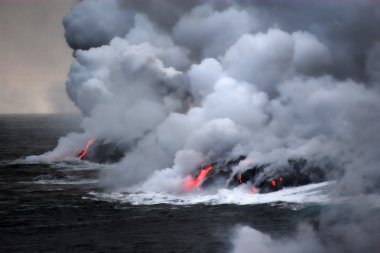 Lava flowing into the ocean clipart