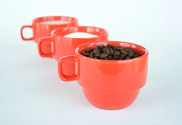 Three cups with coffee sugar and milk — Stock Photo, Image