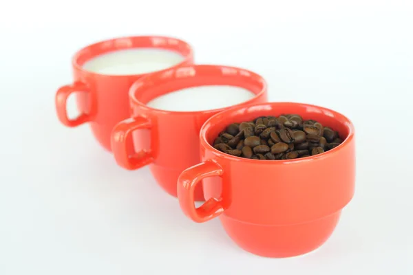 Three cups with coffee sugar and milk — Stock Photo, Image