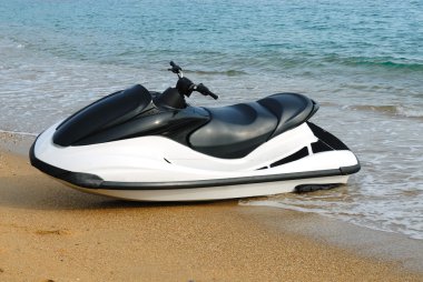 The jet ski parked on the beach. clipart