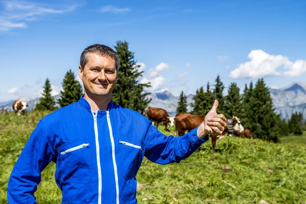 Herdsman and cows — Stock Photo, Image