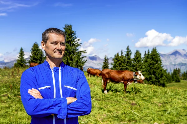 Herdsman and cows — Stock Photo, Image