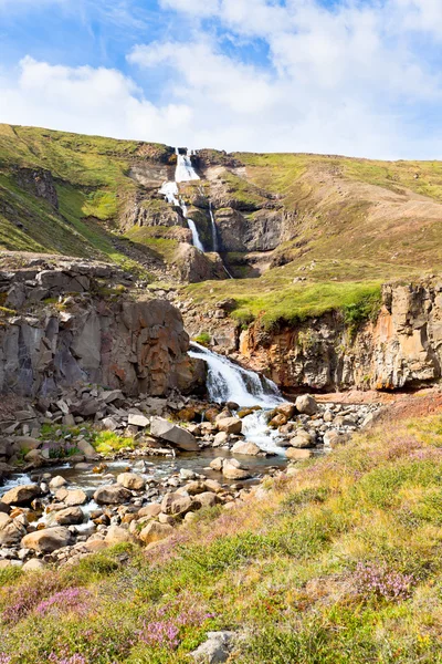 Summer Iceland Landscape with Waterfall and Bright Blue Sky