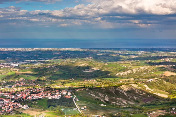 View from Titano mountain at Italian neighborhood and the sea — Stock Photo, Image