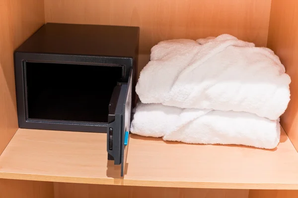 Fresh Bathrobes and Open Safe at Closet Shelf — Stock Photo, Image