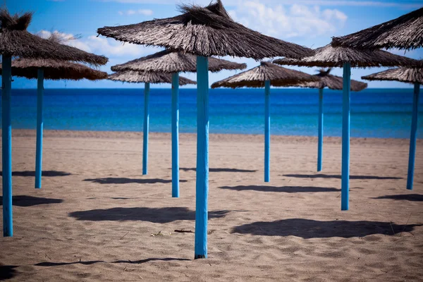 Line of Parasols at Spanish Sand Beach — Stock Photo, Image