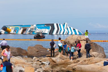 GIGLIO, ITALY - APRIL 28, 2012: Costa Concordia Cruise Ship at I clipart