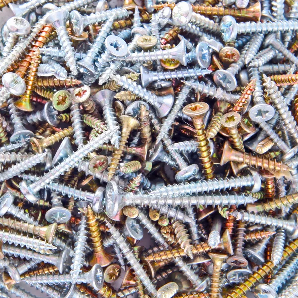 Box with screws close-up background — Stock Photo, Image