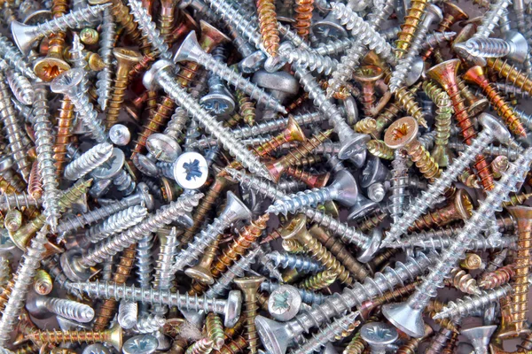 Box with screws close-up background — Stock Photo, Image