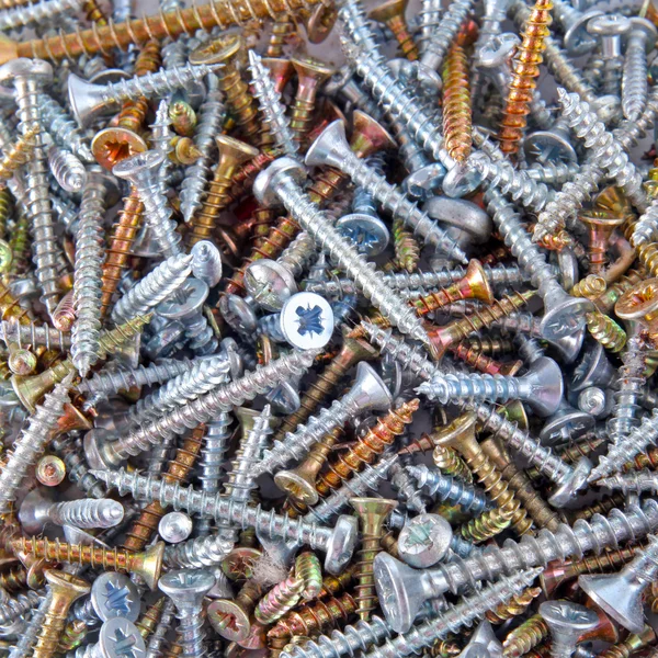 Box with screws close-up background — Stock Photo, Image