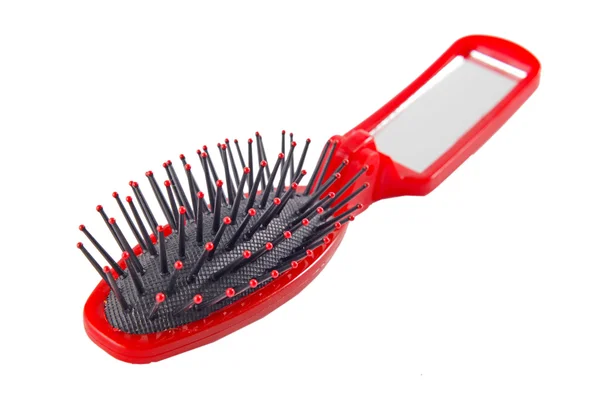 Uma imagem de uma escova de cabelo vermelha no fundo branco — Fotografia de Stock