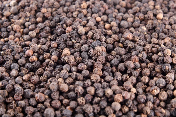 Black pepper background — Stock Photo, Image